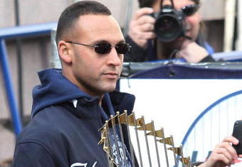 NEW YORK - NOVEMBER 06:  Captain Derek Jeter #2 of the New York Yankees celebrates with the championship trophy during the New York Yankees World Series Victory Celebration at City Hall on November 6, 2009 in New York, New York.  (Photo by Jim McIsaac/Getty Images)