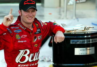 DAYTONA BEACH, FL - FEBRUARY 15: Dale Earnhardt Jr. driver of the #8 DEI Budweiser Chevrolet poses with the Harvey J. Earl Daytona 500 Trophy in victory circle after winning the NASCAR Nextel Cup Daytona 500 on February 15, 2004 at the Daytona International Speedway in Daytona Beach, Florida.  (Photo by Robert Laberge/Getty Images)