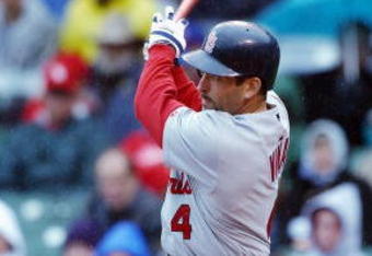 CHICAGO - MAY 11:  Fernando Vina #4 of the St. Louis Cardinals follows through on his swing during the game against the Chicago Cubs at Wrigley Field on May 11, 2003 in Chicago, Illinois.  The game between the Cardinals and the Cubs was postponed until later in the season due to rain after four complete innings.  (Photo by Jonathan Daniel/Getty Images)