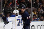 EDMONTON, CANADA - DECEMBER 21: Sheldon Souray #44 of the Edmonton Oilers checks T.J. Oshie #74 of the St. Louis Blues during their NHL game on December 21, 2009 at Rexall Place in Edmonton, Alberta, Canada. (Photo by Dale MacMillan/Getty Images)