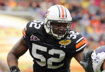 TAMPA, FL - JANUARY 1: Defensive end Antonio Coleman #52 of the Auburn Tigers sets on defense against the Northwestern Wildcats in the Outback Bowl January 1, 2010 at Raymond James Stadium in Tampa, Florida.  (Photo by Al Messerschmidt/Getty Images) 