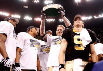 NEW ORLEANS - JANUARY 24:  Jeremy Shockey #88 of the New Orleans Saints celebrates with the George S. Halas trophy against the Minnesota Vikings during the NFC Championship Game at the Louisiana Superdome on January 24, 2010 in New Orleans, Louisiana.  (Photo by Chris Graythen/Getty Images)