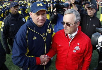 ANN ARBOR, MI - NOVEMBER 21: Head coach Jim Tressel of the Ohio State Buckeyes shakes hands after a 21-10 victory with head coach Rich Rodriguez of the Michigan Wolverines on November 21, 2009 at Michigan Stadium in Ann Arbor, Michigan.  (Photo by Gregory Shamus/Getty Images)