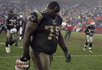 FOXBORO, MA - NOVEMBER 12:  Vince Wilfork #75 of the New England Patriots walks off the field after their loss to the New York Jets on November 12, 2006 at Gillette Stadium in Foxboro, Massachusetts. The Jets defeated the Patriots, 17-14.  (Photo by Elsa/Getty Images)