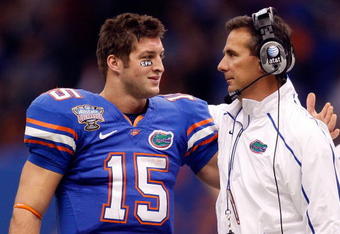 NEW ORLEANS - JANUARY 01:  Quarterback Tim Tebow #15  hugs head coach Urban Meyer of the Florida Gators after scoring a touchdown against the Cincinnati Bearcats during the Allstate Sugar Bowl at the Louisana Superdome on January 1, 2010 in New Orleans, Louisiana.  (Photo by Chris Graythen/Getty Images)