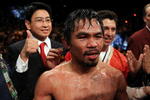 LAS VEGAS - NOVEMBER 14:  (C) Manny Pacquiao celebrates his 12 round TKO victory against Miguel Cotto during their WBO welterweight title fight at the MGM Grand Garden Arena on November 14, 2009 in Las Vegas, Nevada.  (Photo by Al Bello/Getty Images)