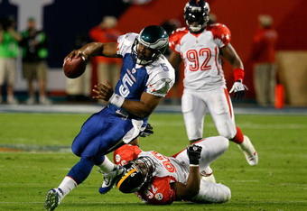 MIAMI GARDENS, FL - JANUARY 31:  James Harrison #92 of the Pittsburgh Steelers chases after Donovan McNabb of the Philadelphia Eagles during the 2010 AFC-NFC Pro Bowl at Sun Life Stadium on January 31, 2010 in Miami Gardens, Florida.  (Photo by Scott Halleran/Getty Images)