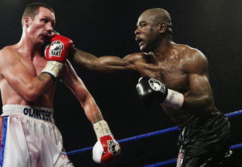 SHEFFIELD- NOVEMBER 7: Clinton Woods of Great Britain (left) in action against Glencoffe Johnson of Jamaica (right) during the IBF Light Heavyweight title fight held at the Hillsborough Leisure Centre in Sheffield,England on the 7th of November 2003. (Photo by John Gichigi/Getty Images)  The fight ended in a draw.     