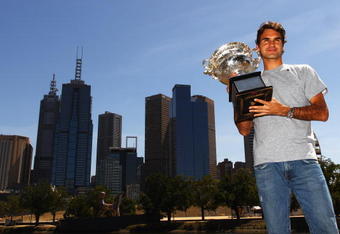MELBOURNE, AUSTRALIA - FEBRUARY 01:  Roger Federer of Switzerland poses with the Australian Open 2010 winners trophy on Boathouse Drive on February 1, 2010 in Melbourne, Australia.  (Photo by Mark Dadswell/Getty Images)