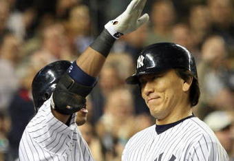 NEW YORK - OCTOBER 07:  Hideki Matsui #55 of the New York Yankees celebrates with teammate Robinson Cano #24 after Matsui hit a two-run home run in the fifth inning against the Minnesota Twins in Game One of the ALDS during the 2009 MLB Playoffs at Yankee Stadium on October 7, 2009 in the Bronx borough of New York City.  (Photo by Jim McIsaac/Getty Images)