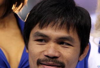 ARLINGTON, TX - JANUARY 19:  Manny Pacquiao poses for photos at Cowboys Stadium on January 19, 2010 in Arlington, Texas.  (Photo by Ronald Martinez/Getty Images)