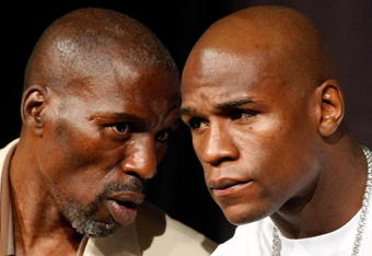 LAS VEGAS - SEPTEMBER 16:  Boxer Floyd Mayweather Jr. (R) and his uncle and trainer Roger Mayweather confer during the final news conference for their bout against Juan Manuel Marquez at the MGM Grand Hotel/Casino September 16, 2009 in Las Vegas, Nevada. Mayweather and Marquez will fight at the MGM Grand Garden Arena on September 19 in Las Vegas.  (Photo by Ethan Miller/Getty Images)