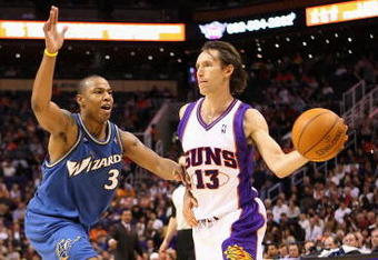 PHOENIX - DECEMBER 19:  Steve Nash #13 of the Phoenix Suns passes the ball under pressure from Caron Butler #3 of the Washington Wizards during the NBA game at US Airways Center on December 19, 2009 in Phoenix, Arizona. The Suns defeated the Wizards 121-95.  NOTE TO USER: User expressly acknowledges and agrees that, by downloading and or using this photograph, User is consenting to the terms and conditions of the Getty Images License Agreement.  (Photo by Christian Petersen/Getty Images)