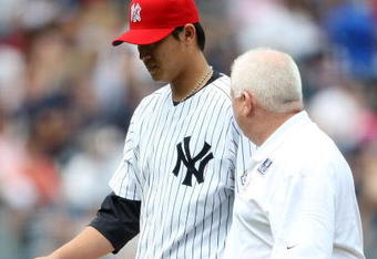 NEW YORK - JULY 04:  Chien-Ming Wang #40 of the New York Yankees leaves the game in the sixth inning with a strained right shoulder against the Toronto Blue Jays on July 4, 2009 at Yankee Stadium in the Bronx borough of New York City.  (Photo by Nick Laham/Getty Images)
