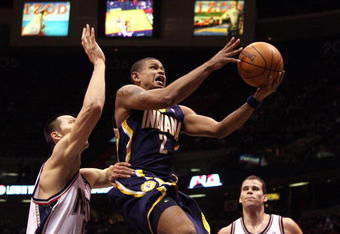 EAST RUTHERFORD, NJ - JANUARY 15:  Earl Watson #3 of the Indiana Pacers drives to the basket against Yi Jianlian #9 of the New Jersey Nets at the Izod Center on January 15, 2010 in East Rutherford, New Jersey. NOTE TO USER: User expressly acknowledges and agrees that, by downloading and or using this photograph, User is consenting to the terms and conditions of the Getty Images License Agreement.  (Photo by Jim McIsaac/Getty Images)