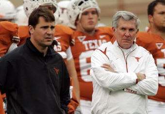 AUSTIN, TX - OCTOBER 10:  Defensive coordinator Will Muschamp and head coach Mack Brown of the Texas Longhorns lead their team in pregame drills before playing the Colorado Buffaloes  on October 10, 2009 at Darrell K Royal-Texas Memorial Stadium in Austin, Texas.  Texas won 38-14.  (Photo by Brian Bahr/Getty Images)