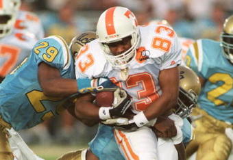3 SEP 1994:  WIDE RECEIVER NILO SILVAN OF THE TENNESSEE VOLUNTEERS ATTEMPTS TO AVOID THE UCLA DEFENSE DURING THE VOLUNTEERS 25-23 LOSS TO THE BRUINS AT THE ROSE BOWL IN PASADENA, CALIFORNIA.  Mandatory Credit: Stephen Dunn/ALLSPORT