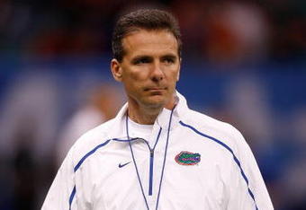 NEW ORLEANS - JANUARY 01:  Head coach Urban Meyer of the Florida Gators watches his team warm up before playing the Cincinnati Bearcats during the Allstate Sugar Bowl at the Louisana Superdome on January 1, 2010 in New Orleans, Louisiana.  (Photo by Chris Graythen/Getty Images)