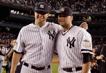 NEW YORK - SEPTEMBER 21: Phil Hughes #65 (L) and Joba Chamberlain #62 of the New York Yankees pose for a photograph after the last regular season game at Yankee Stadium on September 21, 2008 in the Bronx borough of New York City. The Yankees are playing their final season in the 85 year old ball park and plan on moving into the new Yankee Stadium across the street to start the 09 season. (Photo by Jim McIsaac/Getty Images) 