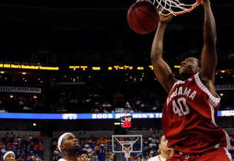 TAMPA, FL - MARCH 13:  Justin Knox #40 of the Alabama Crimson Tide dunks the ball around Josh Tabb #25 of the Tennessee Volunteers during the quaterfinal round of the SEC Men's Basketball Tournament on March 13, 2009 at The St. Pete Times Forum in Tampa, Florida.  (Photo by Chris Graythen/Getty Images)