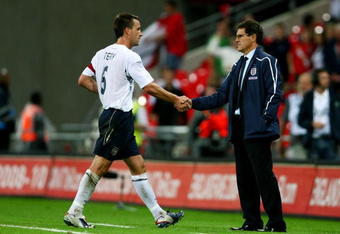 LONDON - AUGUST 20:  England captain John Terry greets England manager Fabio Capello after the international friendly match between England and the Czech Republic at Wembley Stadium on August 20, 2008 in London, England.  (Photo by Phil Cole/Getty Images)