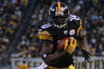 PITTSBURGH - DECEMBER 20:  Santonio Holmes #10 of the Pittsburgh Steelers runs with the ball against the Green Bay Packers during the game on December 20, 2009 at Heinz Field in Pittsburgh, Pennsylvania.  (Photo by Jared Wickerham/Getty Images)