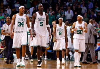 BOSTON - MAY 22:  Paul Pierce #34, Kevin Garnett #5, Rajon Rondo #9, and Eddie House #50 of the Boston Celtics walks on the court towards the end of the game against the Detroit Pistons during Game Two of the 2008 NBA Eastern Conference finals at the TD Banknorth Garden on May 22, 2008 in Boston, Massachusetts. NOTE TO USER: User expressly acknowledges and agrees that, by downloading and or using this photograph, User is consenting to the terms and conditions of the Getty Images License Agreement  (Photo by Jim Rogash/Getty Images)