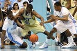 CHAPEL HILL, NC - JANUARY 16:  Gani Lawal #31 of the Georgia Tech Yellow Jackets battles for a loose ball with teammates Ed Davis #32 and Larry Drew II #11 of the North Carolina Tar Heels during their game at the Dean Smith Center on January 16, 2010 in Chapel Hill, North Carolina.  (Photo by Streeter Lecka/Getty Images)