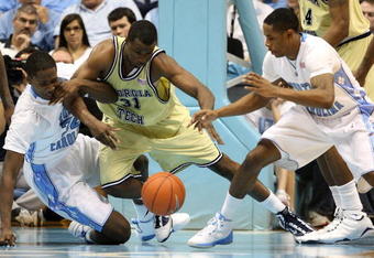 CHAPEL HILL, NC - JANUARY 16:  Gani Lawal #31 of the Georgia Tech Yellow Jackets battles for a loose ball with teammates Ed Davis #32 and Larry Drew II #11 of the North Carolina Tar Heels during their game at the Dean Smith Center on January 16, 2010 in Chapel Hill, North Carolina.  (Photo by Streeter Lecka/Getty Images)