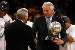 LOS ANGELES, CA - MAY 29:  (L-R) NBA legend Jerry West shakes hands with Los Angeles Lakers general manager Mitch Kupchak after defeating the Lakers defeated the San Antonio Spurs 100-92 in Game Five of the Western Conference Finals during the 2008 NBA Playoffs on May 29, 2008 at Staples Center in Los Angeles, California.  NOTE TO USER: User expressly acknowledges and agrees that, by downloading and/or using this Photograph, user is consenting to the terms and conditions of the Getty Images License Agreement.  (Photo by Jeff Gross/Getty Images)