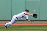 BOSTON - OCTOBER 11:  Jacoby Ellsbury #46 of the Boston Red Sox makes a diving catch on a Bobby Abreu #53 of the Los Angeles Angels of Anaheim flyout in the third inning of Game Three of the ALDS during the 2009 MLB Playoffs at Fenway Park on October 11, 2009 in Boston,  Massachusetts. (Photo by Jim Rogash/Getty Images)