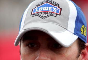 DAYTONA BEACH, FL - FEBRUARY 05:  Jimmie Johnson, driver of the #48 Lowe's Chevrolet, walks in the garage area during practice for the NASCAR Sprint Cup Series Daytona 500 at Daytona International Speedway on February 5, 2010 in Daytona Beach, Florida.  (Photo by Jerry Markland/Getty Images for NASCAR)