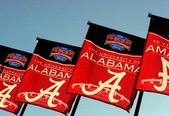 PASADENA, CA - JANUARY 07:  The Alabama Crimson Tide flags wave outside the stadium prior to the game against the Texas Longhorns in the Citi BCS National Championship game at the Rose Bowl on January 7, 2010 in Pasadena, California.  (Photo by Harry How/Getty Images)