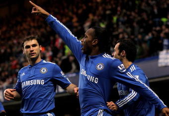 LONDON, ENGLAND - FEBRUARY 07:  Didier Drogba of Chelsea celebrates scoring the first goal of the game with team mates during the Barclays Premier League match between Chelsea and Arsenal at Stamford Bridge on February 7, 2010 in London, England.  (Photo by Paul Gilham/Getty Images)