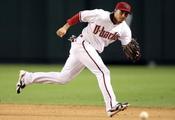 PHOENIX - JULY 08:  Infielder Felipe Lopez #2 of the Arizona Diamondbacks attempts to field a single hit by the San Diego Padres during the major league baseball game at Chase Field on July 8, 2009 in Phoenix, Arizona.  The Diamondbacks defeated the Padres 6-2.  (Photo by Christian Petersen/Getty Images)
