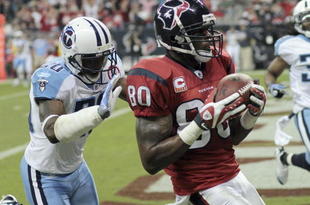 HOUSTON - NOVEMBER 23:  Wide receiver Andre Johnson #80 scores in the second quarter as he beats cornerback Nick Harper #20 of the Tennessee Titans at Reliant Stadium on November 23, 2009 in Houston, Texas.  (Photo by Bob Levey/Getty Images)