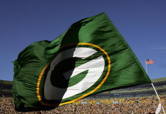 GREEN BAY, WI - OCTOBER 29:  A Green Bay Packers flag is waved during a game against the Arizona Cardinals at Lambeau Field on October 29, 2006 in Green Bay Wisconsin.  The Packers won 31-14.  (Photo by Stephen Dunn/Getty Images)