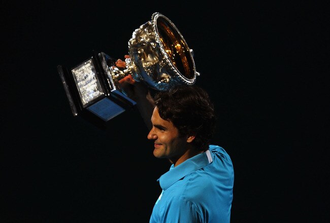 MELBOURNE, AUSTRALIA - JANUARY 31:  Roger Federer of Switzerland holds aloft the Norman Brookes Challenge Cup after his men's final match against Andy Murray of Great Britain during day fourteen of the 2010 Australian Open at Melbourne Park on January 31, 2010 in Melbourne, Australia.  (Photo by Lucas Dawson/Getty Images)