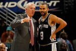 NEW ORLEANS - JANUARY 18:  Head coach Gregg Popovich and Tony Parker #9 of the San Antonio Spurs talk during a timeout against the New Orleans Hornets at New Orleans Arena on January 18, 2010 in New Orleans, Louisiana.   NOTE TO USER: User expressly acknowledges and agrees that, by downloading and/or using this Photograph, User is consenting to the terms and conditions of the Getty Images License Agreement.  (Photo by Chris Graythen/Getty Images)