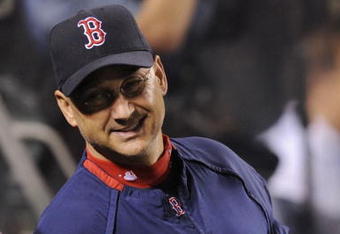 ANAHEIM, CA - OCTOBER 09:  Manager Terry Francona of the Boston Red Sox smiles in the dugout in Game Two of the ALDS during the MLB playoffs against the Los Angeles Angels of Anaheim at Angel Stadium on October 9, 2009 in Anaheim, California. (Photo by Kevork Djansezian/Getty Images)