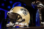 FORT LAUDERDALE, FL - FEBRUARY 05:  A New Orleans Saints helmet and the Vince Lombardi Trophy is seen during the NFC Head Coach Press Conference held at the Greater Ft. Lauderdale/Broward County Convention Center as part of media week for Super Bowl XLIV on February 5, 2010 in Fort Lauderdale, Florida.  (Photo by Chris Graythen/Getty Images)