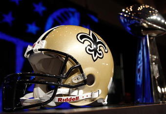 FORT LAUDERDALE, FL - FEBRUARY 05:  A New Orleans Saints helmet and the Vince Lombardi Trophy is seen during the NFC Head Coach Press Conference held at the Greater Ft. Lauderdale/Broward County Convention Center as part of media week for Super Bowl XLIV on February 5, 2010 in Fort Lauderdale, Florida.  (Photo by Chris Graythen/Getty Images)