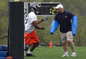 LAKE FOREST, IL - MAY 01: Defensive line coach Rob Marinelli of the Chicago Bears, former head coach of the Detroit Lions, works with Jarron Gilbert #73 during a rookie mini-camp practice on May 1, 2009 at Halas Hall in Lake Forest, Illinois. (Photo by Jonathan Daniel/Getty Images)