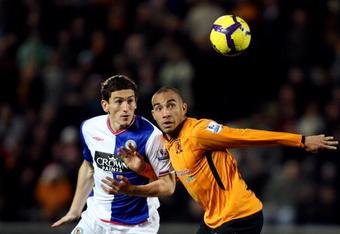 HULL, ENGLAND - DECEMBER 12:  Keith Andrews of Blackburn is challenged by Craig Fagan of Hull during the Barclays Premier League match between Hull City and  Blackburn Rovers at the KC Stadium on December 12, 2009 in Hull, England.  (Photo by Ross Kinnaird/Getty Images)