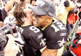 NEW ORLEANS - JANUARY 24:  (L-R) Drew Brees #9 and Marques Colston #12 of the New Orleans Saints celebrate after the Saints 31-28 overtime win against the Minnesota Vikings during the NFC Championship Game at the Louisiana Superdome on January 24, 2010 in New Orleans, Louisiana.  (Photo by Chris Graythen/Getty Images)