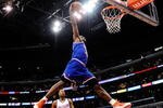 LOS ANGELES, CA - JANUARY 16:  LeBron James #23 of the Cleveland Caveliers dunks the ball against the Los Angeles Clippers during the first quarter of the NBA basketball game at Staples Center on January 16, 2010 in Los Angeles, California. NOTE TO USER: User expressly acknowledges and agrees that, by downloading and or using this photograph, User is consenting to the terms and conditions of the Getty Images License Agreement.  (Photo by Kevork Djansezian/Getty Images)
