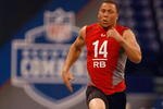 INDIANAPOLIS, IN - FEBRUARY 22:  Running back Ian Johnson of Boise State runs the 40 yard dash during the NFL Scouting Combine presented by Under Armour at Lucas Oil Stadium on February 22, 2009 in Indianapolis, Indiana. (Photo by Scott Boehm/Getty Images)