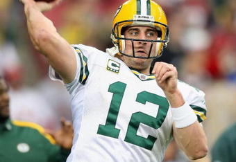 GLENDALE, AZ - JANUARY 10:  Quarterback Aaron Rodgers #12 of the Green Bay Packers warms up before the 2010 NFC wild-card playoff game against the Arizona Cardinals at the Universtity of Phoenix Stadium on January 10, 2010 in Glendale, Arizona.  The Cardinals defeated the Packers  51-45 in overtime.  (Photo by Christian Petersen/Getty Images)