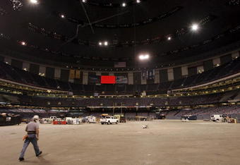 NEW ORLEANS - AUGUST 24:  A construction worker walks across the floor of the Louisiana Superdome August 24, 2006 in New Orleans, Louisiana. The Superdome has received a $185 million facelift after it was heavily damaged during Hurricane Katrina and is expected to re-open just over a year after it was damaged with a Monday night NFL football game with the New Orleans Saints versus the Atlanta Falcons on September 25.  (Photo by Justin Sullivan/Getty Images)