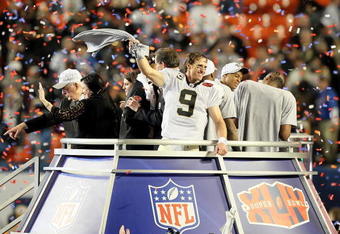 MIAMI GARDENS, FL - FEBRUARY 07:  Drew Brees #9 of the New Orleans Saints celebrates after defeating the Indianapolis Colts during Super Bowl XLIV on February 7, 2010 at Sun Life Stadium in Miami Gardens, Florida.  (Photo by Jed Jacobsohn/Getty Images)